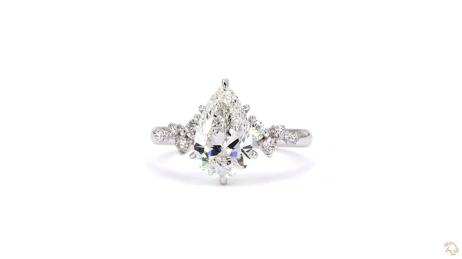 Pear cut ring with diamond studded pave band