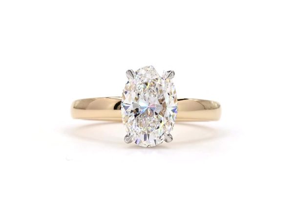 Oval diamond ring with hidden halo