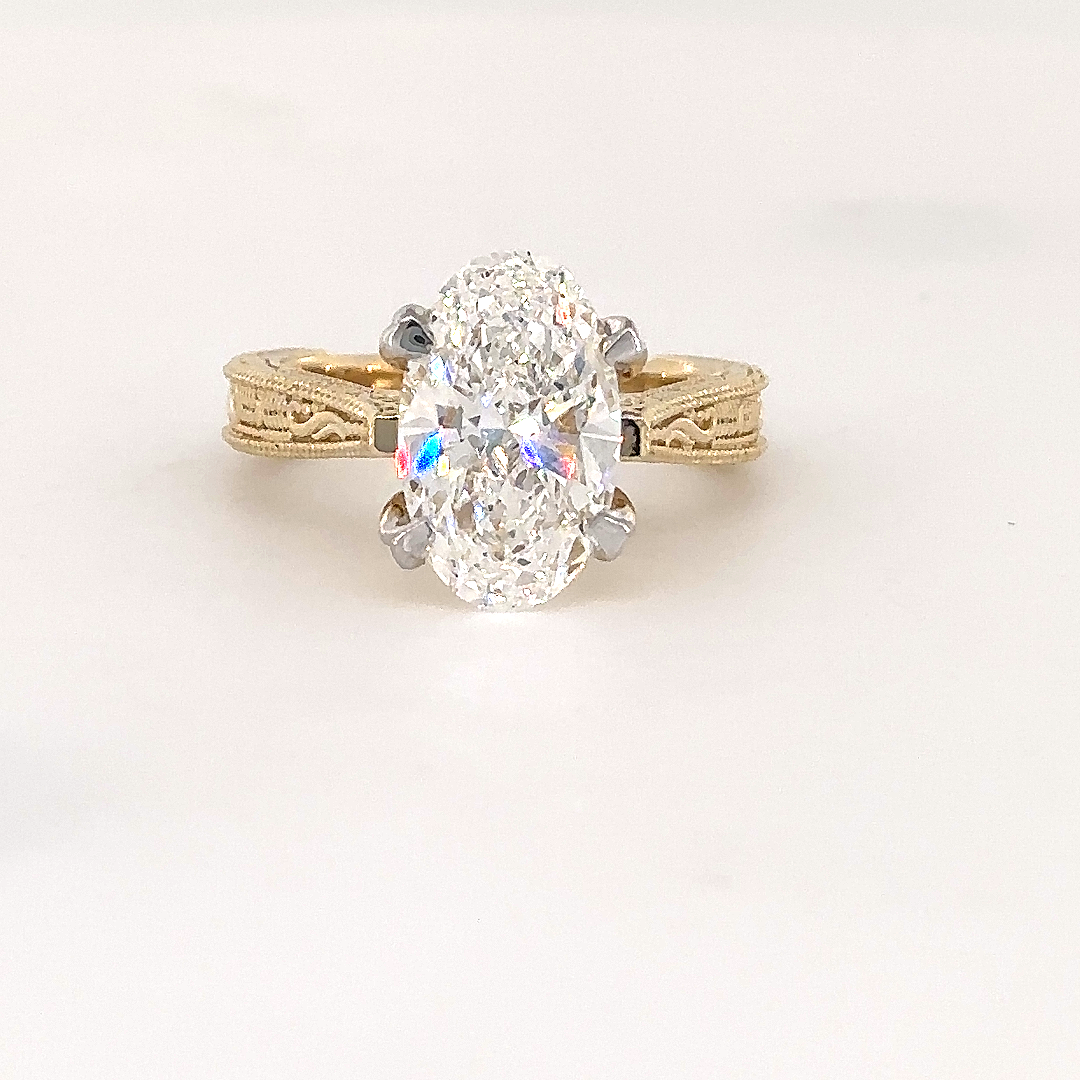 Oval cut solitaire filigree ring