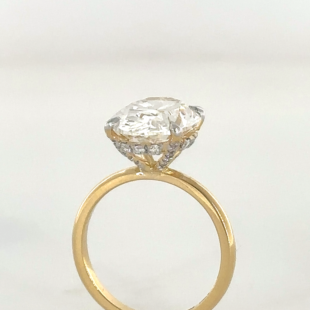 Oval ring with hidden halo set in diamond studded claws - Image 2