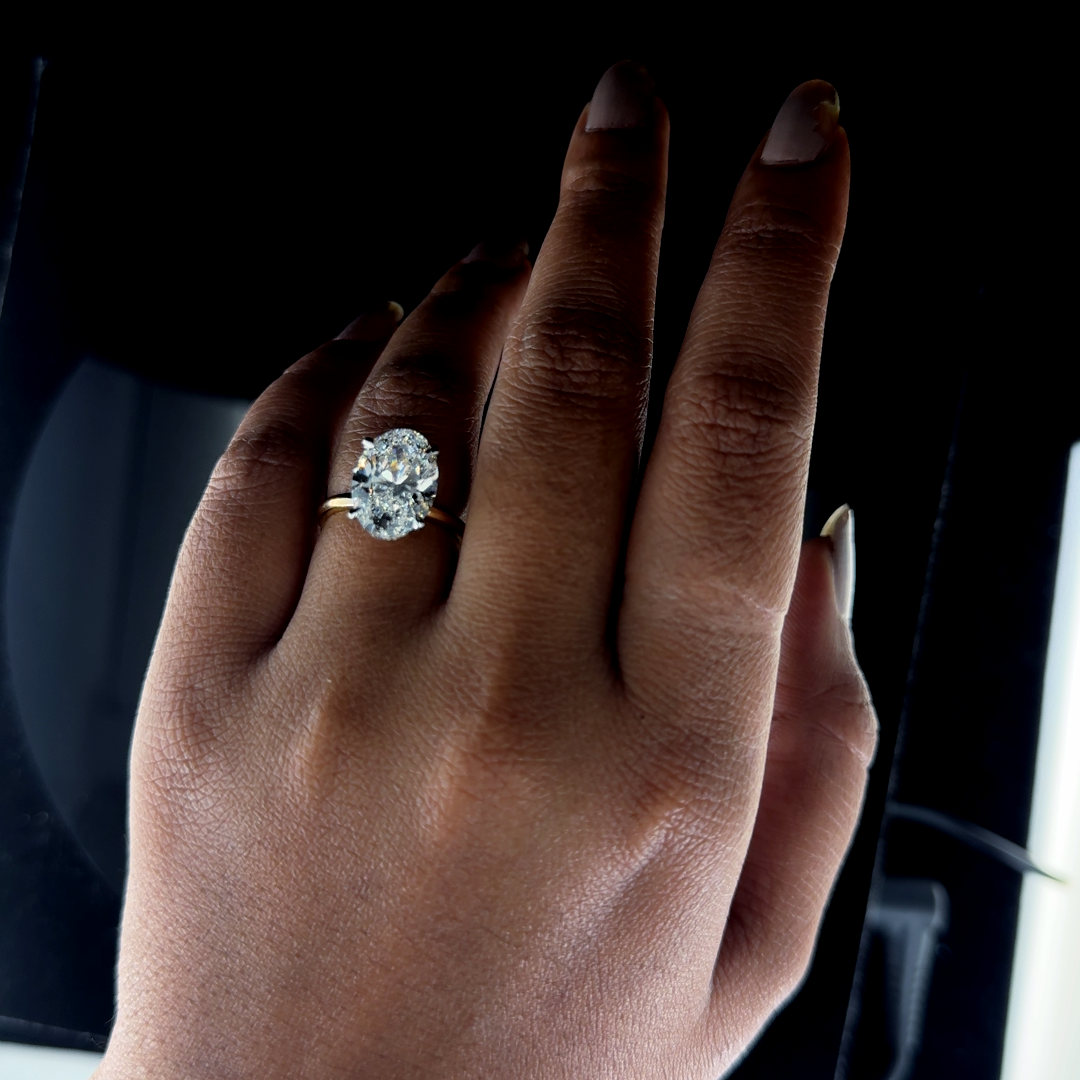 Oval ring with hidden halo set in diamond studded claws - Image 3