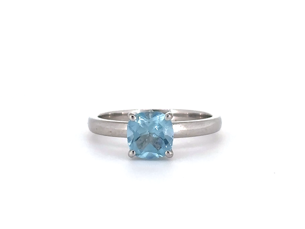Aquamarine Cushion cut ring set in diamond studded claws