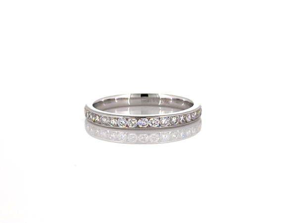 Round cut diamond ring in 3/4 way Channel setting