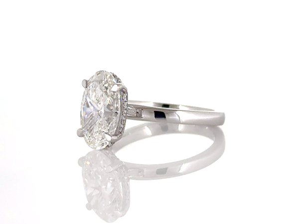 Oval cut diamond ring with hidden halo