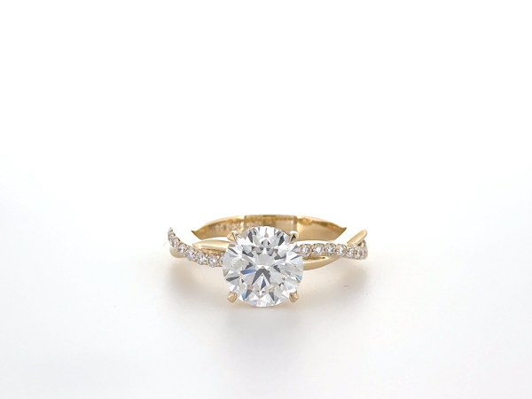 Round diamond ring with hidden halo and pave band